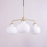 Modern Gold Metal and Opal Glass Globe Pendant Light for Contemporary Interiors