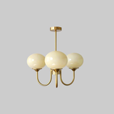 Modern Marshmallow Chandelier with Pink Glass Shades and Gold Finish Lighting