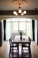 modern-mid-century-glass-globe-chandelier-with-metal-rod-frame-and-white-opal-shades