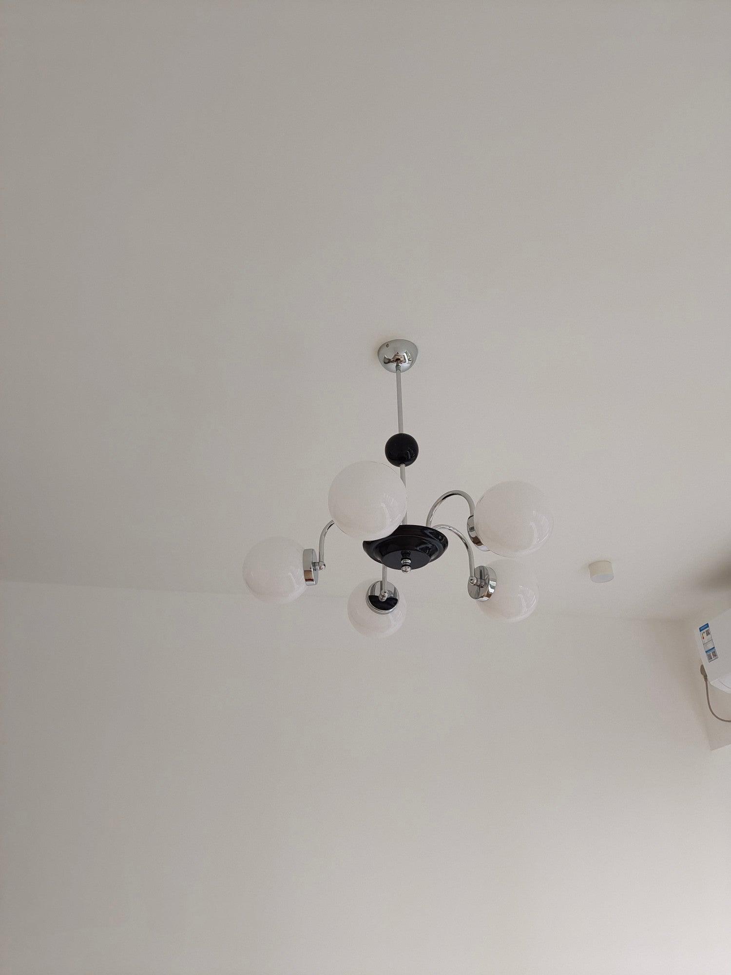 modern-mid-century-glass-globe-chandelier-with-metal-rod-frame-and-white-opal-shades