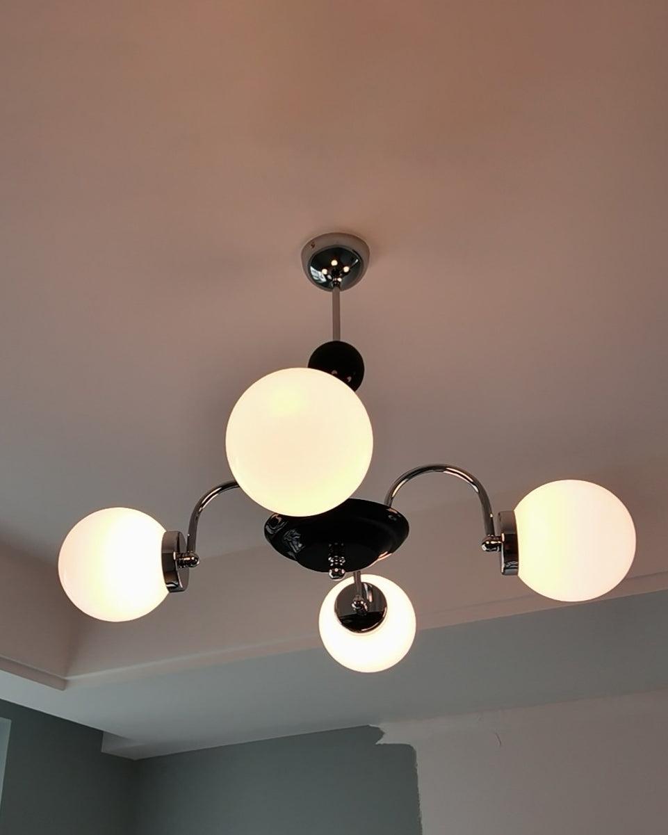 modern-mid-century-glass-globe-chandelier-with-metal-rod-frame-and-white-opal-shades
