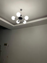 modern-mid-century-glass-globe-chandelier-with-metal-rod-frame-and-white-opal-shades