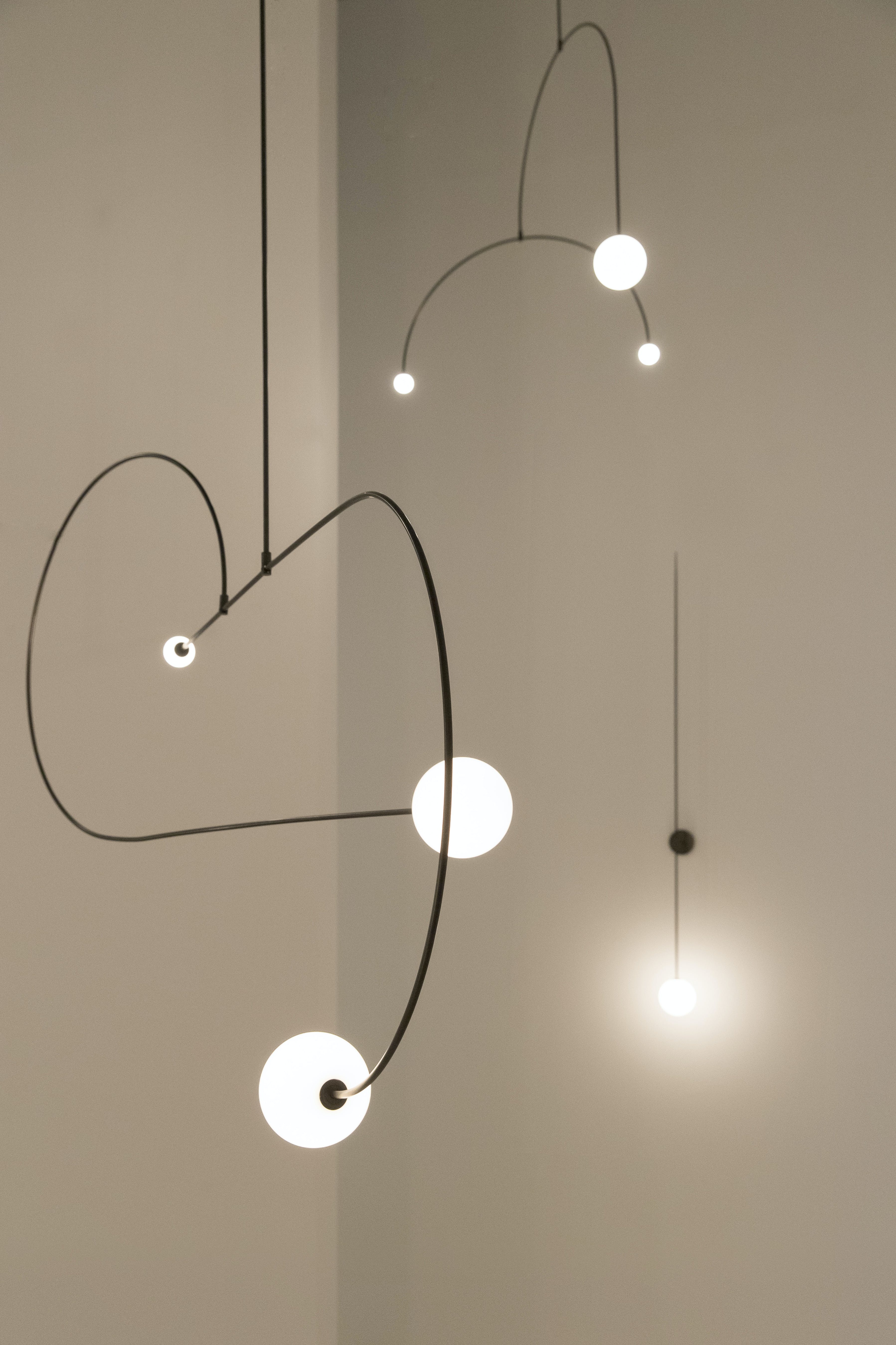 Modern Minimalist Linear Mobile Chandelier with Opal Glass Globes and Black Finish