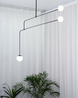 Modern Minimalist Linear Mobile Chandelier with Opal Glass Globes and Black Finish