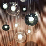 modern-pearl-sphere-pendant-lamp-with-matte-inner-core-and-clear-glass-shade