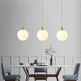 Modern Spherical Glass Pendant Light Brass and Black Contemporary Ceiling Hanging Fixture