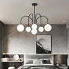 Modern Sputnik Chandelier with Milky White Ball Glass Shades and Curved Linear Gold or Black Frame