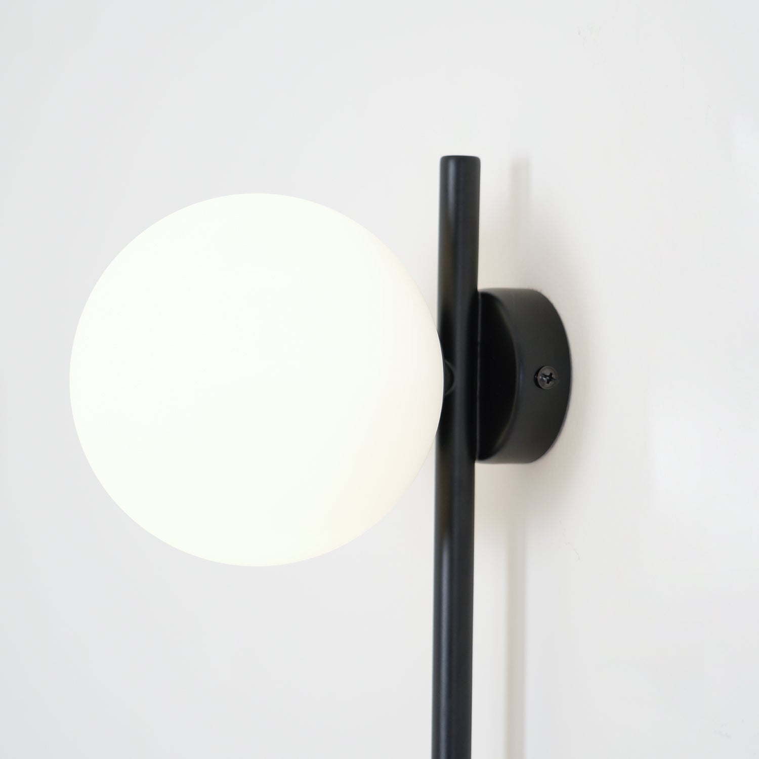 Modern Tall Vertical Stem Wall Lamp with White Glass Globe and Plug In Cord