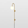 Modern Vertical Brass Wall Sconce with Globe Glass Shade Plug In Lighting Fixture