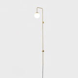 Modern Vertical Brass Wall Sconce with Globe Glass Shade Plug In Lighting Fixture