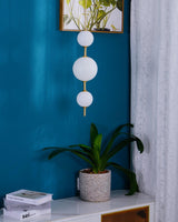 Modern Vertical Glass Globe Pendant Light in Black and Brass Finishes