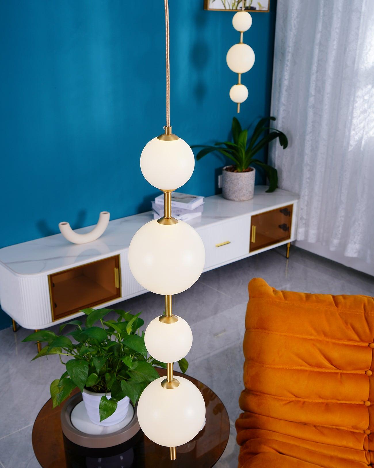 Modern Vertical Glass Globe Pendant Light in Black and Brass Finishes