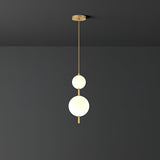 Modern Vertical Glass Globe Pendant Light in Black and Brass Finishes