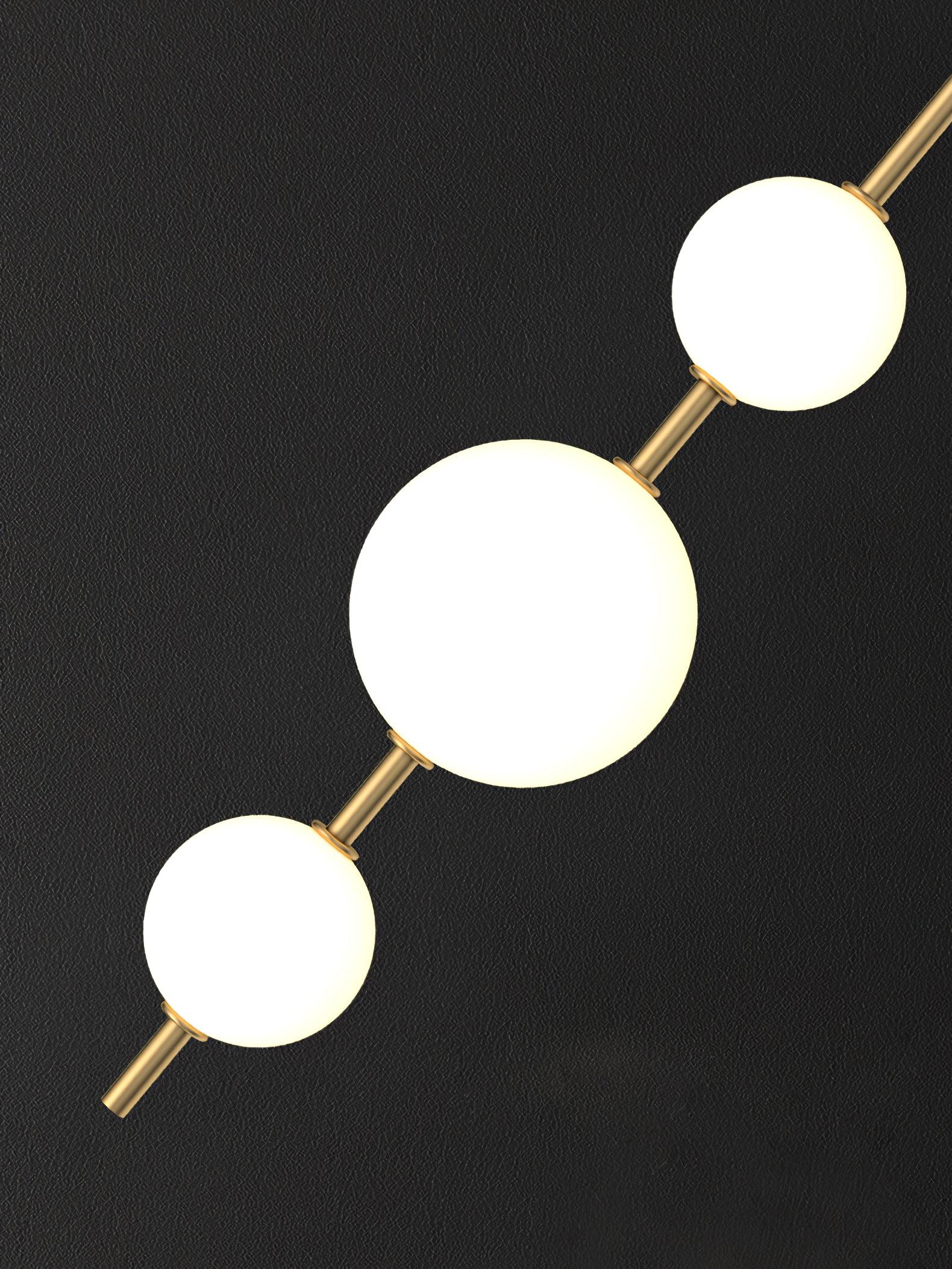 Modern Vertical Glass Globe Pendant Light in Black and Brass Finishes