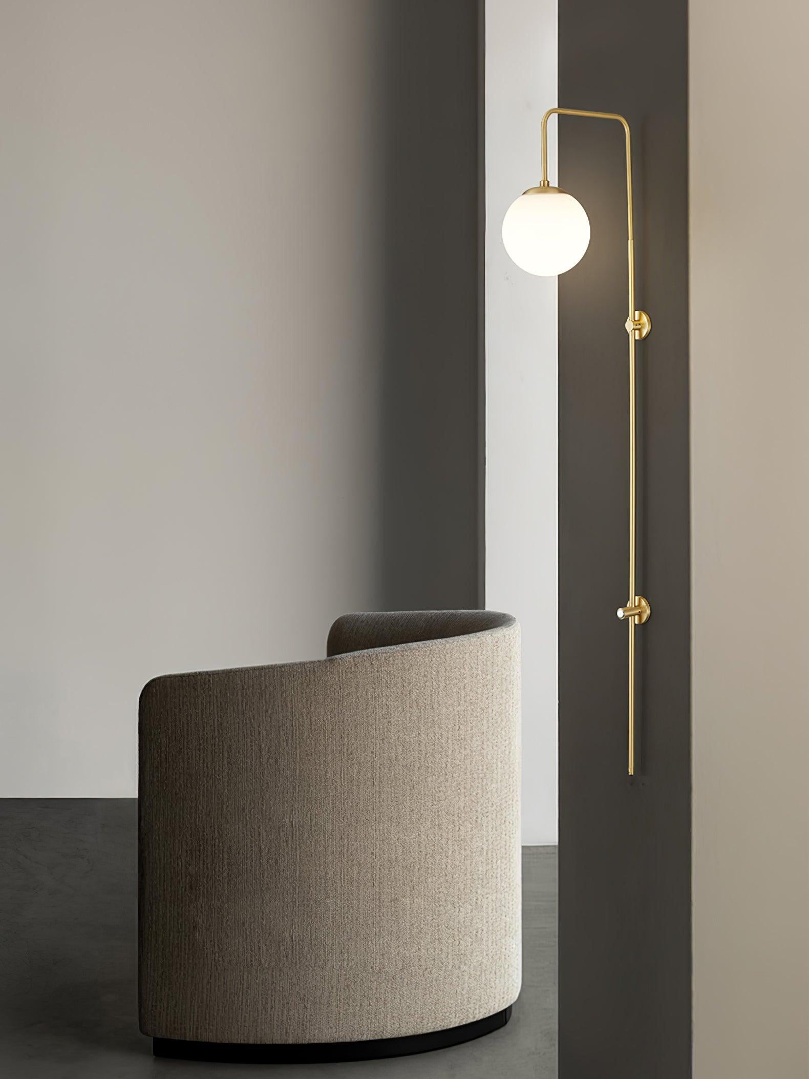 Modern Vertical Gold Wall Sconce with Spherical White Glass Globe Diffuser