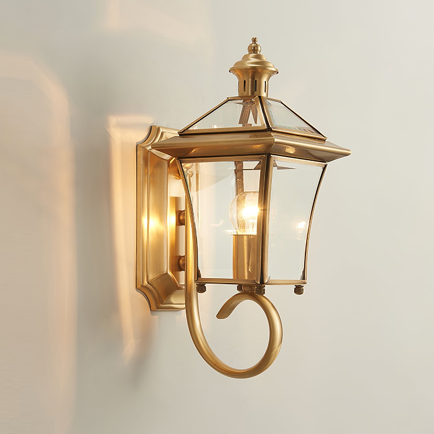 monterey-brass-outdoor-wall-sconce-with-glass-shade-for-exterior-porch-lighting