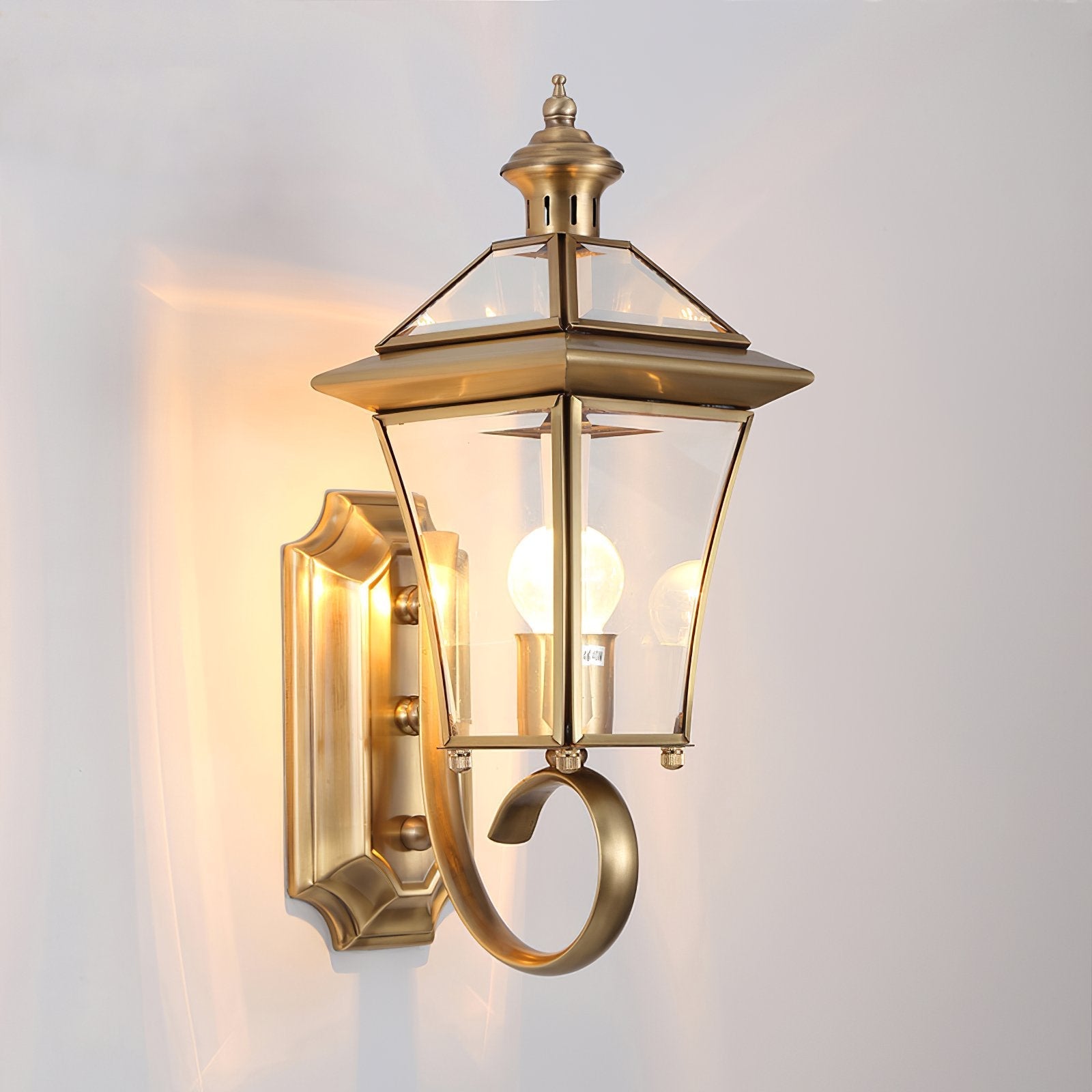 monterey-brass-outdoor-wall-sconce-with-glass-shade-for-exterior-porch-lighting