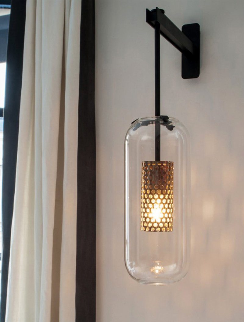 modern-vadim-glass-wall-sconce-with-perforated-metal-cage-and-brass-finish-for-luxury-interiors