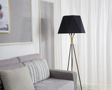 modern-solitaire-tripod-floor-lamp-with-black-polygonal-cloth-shade-and-brass-accents