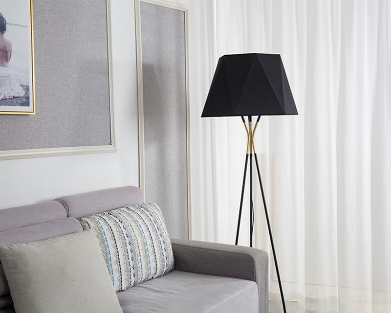 modern-solitaire-tripod-floor-lamp-with-black-polygonal-cloth-shade-and-brass-accents