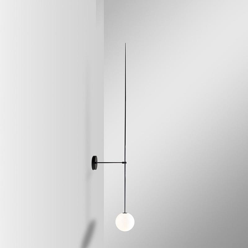 modern-brass-and-opal-glass-sphere-mobile-wall-sconce-lighting-for-indoor-spaces