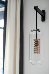modern-vadim-glass-wall-sconce-with-perforated-metal-cage-and-brass-finish-for-luxury-interiors