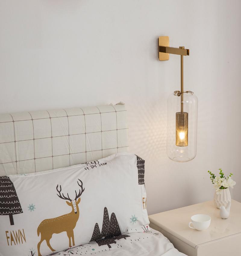 modern-vadim-glass-wall-sconce-with-perforated-metal-cage-and-brass-finish-for-luxury-interiors