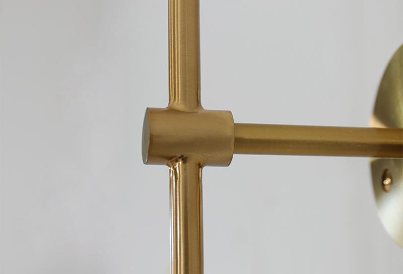 modern-brass-and-opal-glass-sphere-mobile-wall-sconce-lighting-for-indoor-spaces