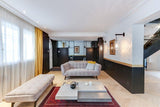 modern-vadim-glass-wall-sconce-with-perforated-metal-cage-and-brass-finish-for-luxury-interiors