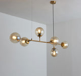 contemporary-multi-glass-globe-pendant-light-with-round-orb-shades-and-polished-brass-frame