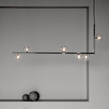modern-linear-chandelier-with-clear-glass-globe-shades-for-geometric-dining-room-lighting