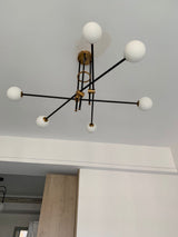 modern-hand-blown-glass-globe-chandelier-with-elegant-brass-and-copper-finishes
