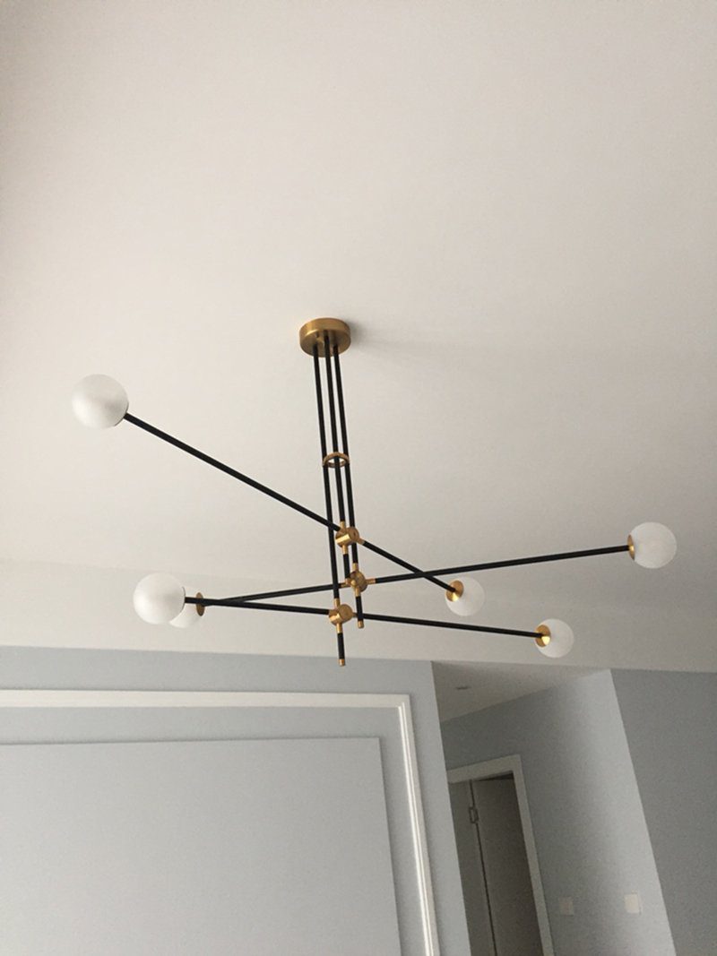 modern-hand-blown-glass-globe-chandelier-with-elegant-brass-and-copper-finishes