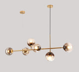 contemporary-multi-glass-globe-pendant-light-with-round-orb-shades-and-polished-brass-frame