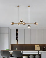 contemporary-multi-glass-globe-pendant-light-with-round-orb-shades-and-polished-brass-frame