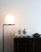 modern-industrial-gold-standing-lamp-with-white-glass-globe-shade-and-foot-switch