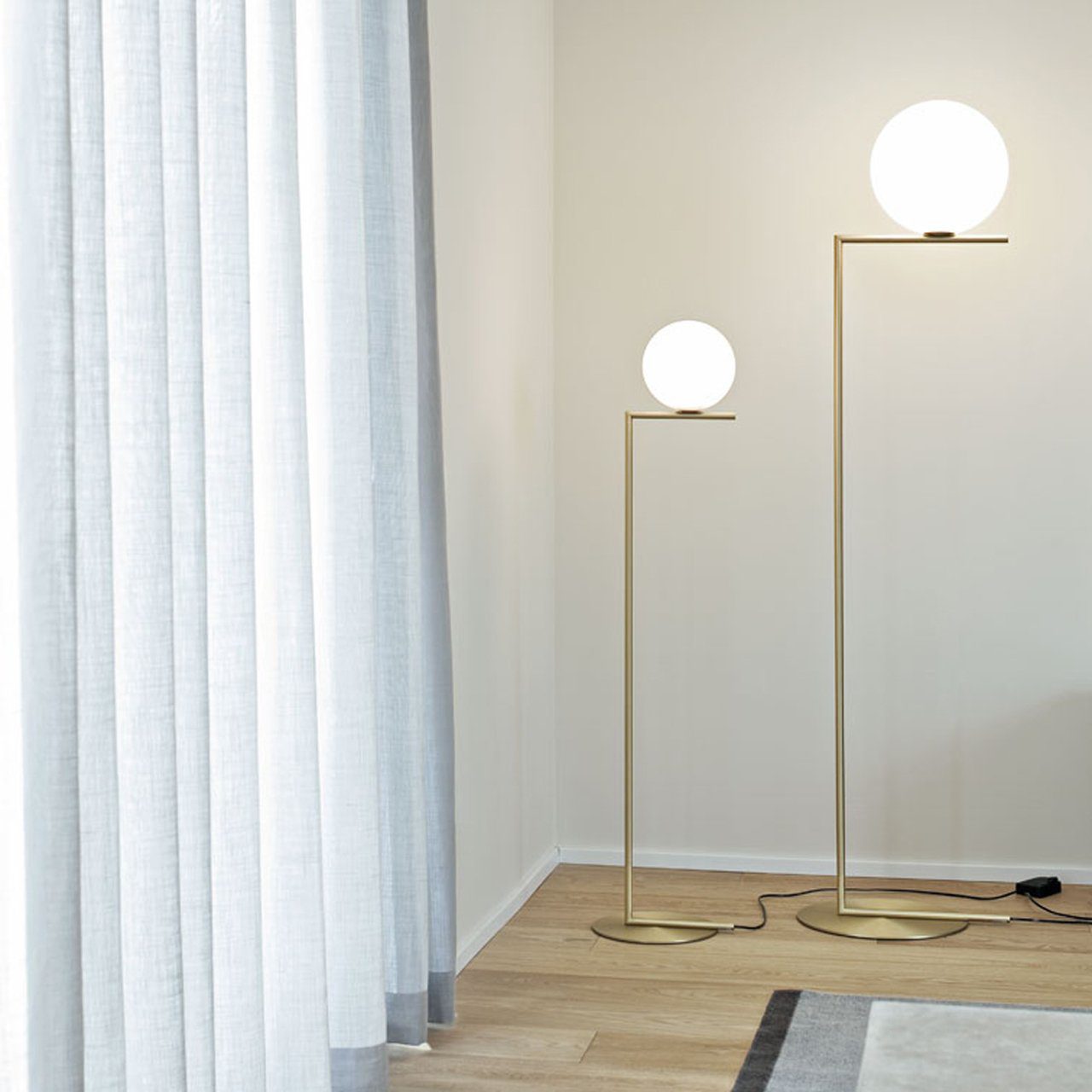 modern-industrial-gold-standing-lamp-with-white-glass-globe-shade-and-foot-switch