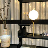modern-opalescent-blown-glass-globe-table-lamp-with-flexible-steel-base-and-gold-finish