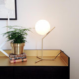 modern-opalescent-blown-glass-globe-table-lamp-with-flexible-steel-base-and-gold-finish