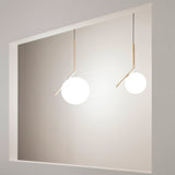 modern-brass-and-opal-glass-globe-pendant-light-minimalist-baton-design-hanging-lamp