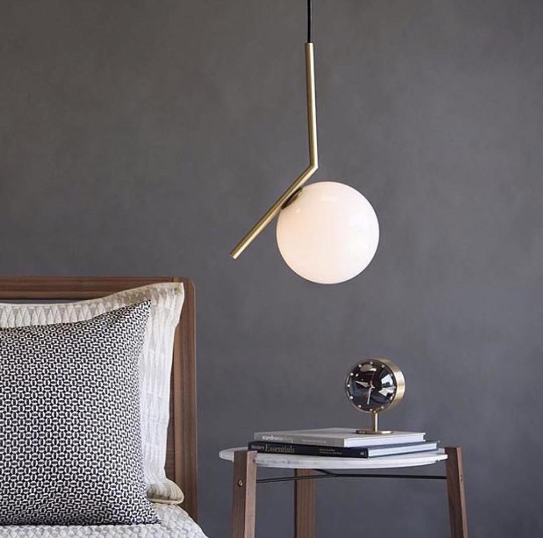 modern-brass-and-opal-glass-globe-pendant-light-minimalist-baton-design-hanging-lamp