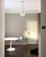 modern-brass-and-opal-glass-globe-pendant-light-minimalist-baton-design-hanging-lamp