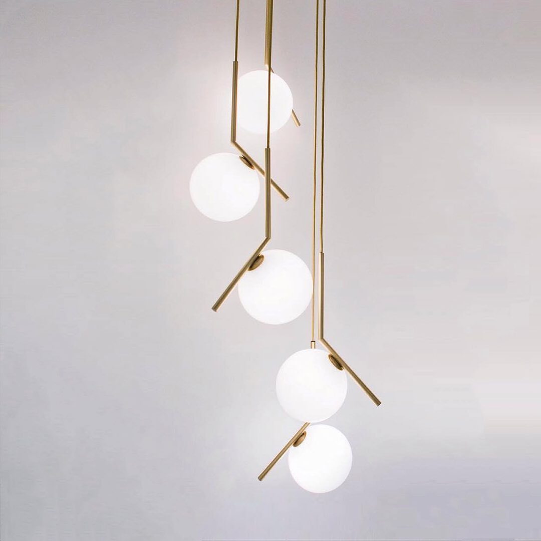 modern-brass-and-opal-glass-globe-pendant-light-minimalist-baton-design-hanging-lamp