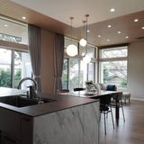 modern-brass-and-opal-glass-globe-pendant-light-minimalist-baton-design-hanging-lamp