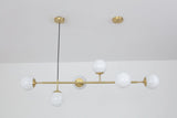 contemporary-multi-glass-globe-pendant-light-with-round-orb-shades-and-polished-brass-frame