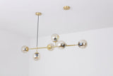 contemporary-multi-glass-globe-pendant-light-with-round-orb-shades-and-polished-brass-frame