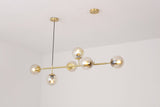 contemporary-multi-glass-globe-pendant-light-with-round-orb-shades-and-polished-brass-frame