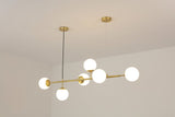 contemporary-multi-glass-globe-pendant-light-with-round-orb-shades-and-polished-brass-frame