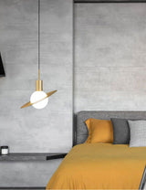 saturn-modern-celestial-sphere-pendant-light-with-swiveling-brass-ring-and-opal-glass-shade