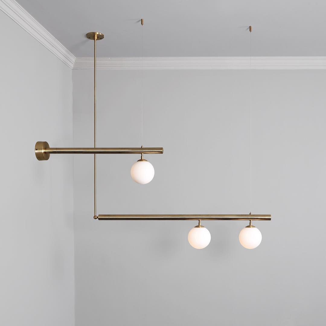 modern-geometric-satellite-pendant-light-with-opal-glass-globes-and-adjustable-brass-arms